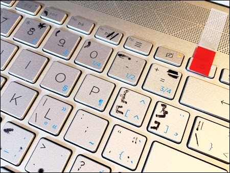 laptop keyboard with sharpie letters