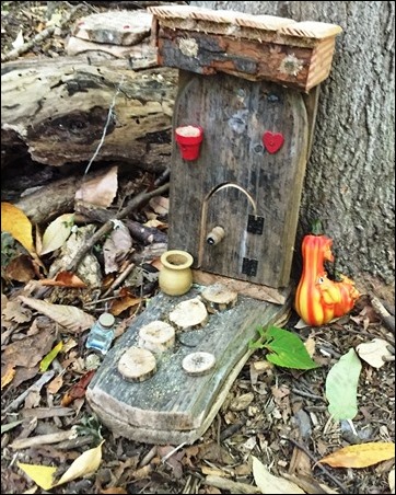 fairy house on the ground, with a little door