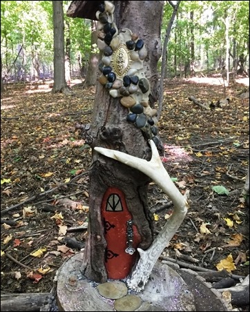 house with bright red door, and an antler on the side